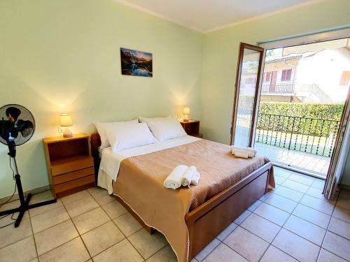 Posteľ alebo postele v izbe v ubytovaní Beach Apartment Cannobio