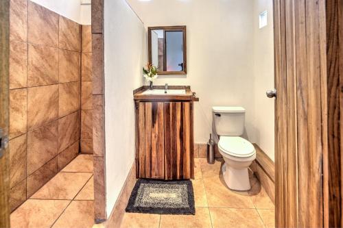 a bathroom with a toilet and a sink and a shower at Colibri Ecolodge 3 minutes walk to beach and town in Puerto Viejo