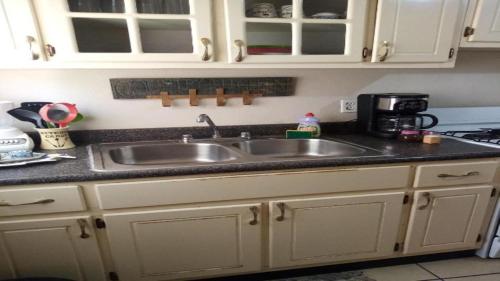 a kitchen with a sink and a counter top at Apartment Summer in Puerto Peñasco