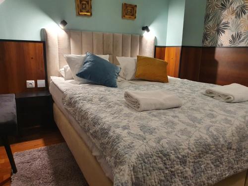 a bedroom with a bed with two pillows on it at Chata nad Sztolnią in Bystrzyca Górna