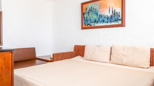Puerto Nuevo Baja Hotel & Villasにあるベッド