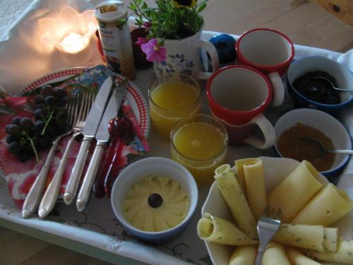 a tray of food with fruit and other foods on it at Rustherberg in Valthermond