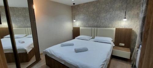 Postel nebo postele na pokoji v ubytování Hotel Visitor