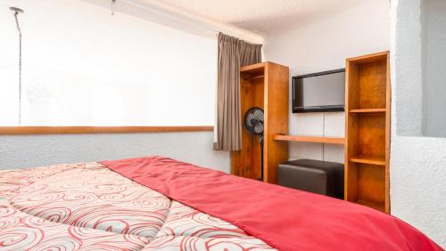 Puerto Nuevo Baja Hotel & Villasにあるベッド