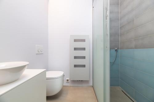 a bathroom with a toilet and a sink and a shower at Villa Frida in Zambratija