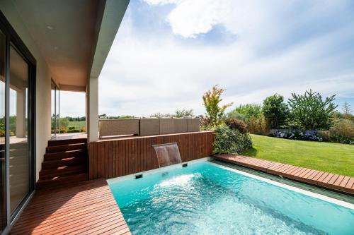 a swimming pool in the backyard of a house at Villa Frida in Zambratija