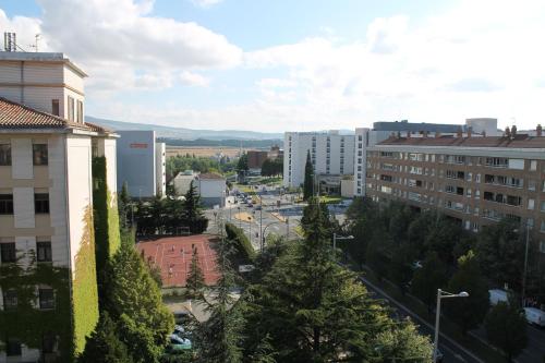 a view of a city with trees and buildings at Hotel Blanca de Navarra in Pamplona