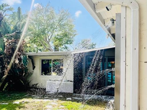 a water fountain in front of a house at Close to beaches with hot tub and large garden in Sarasota