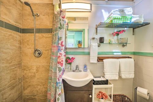 a bathroom with a sink and a shower at Sea Turtle Suite Condo with Clearwater Beach Views in Clearwater Beach