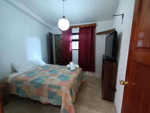 Ένα ή περισσότερα κρεβάτια σε δωμάτιο στο Hotel del Bosque