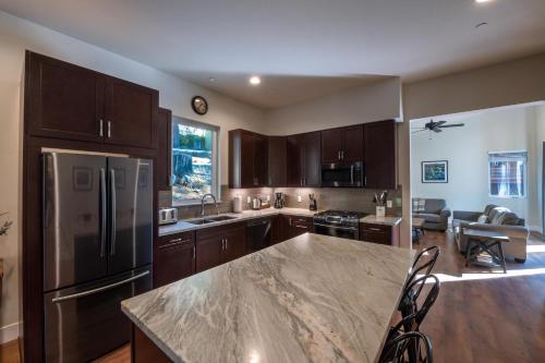 a kitchen with wooden cabinets and a large counter top at Boulder Ridge in Yosemite West