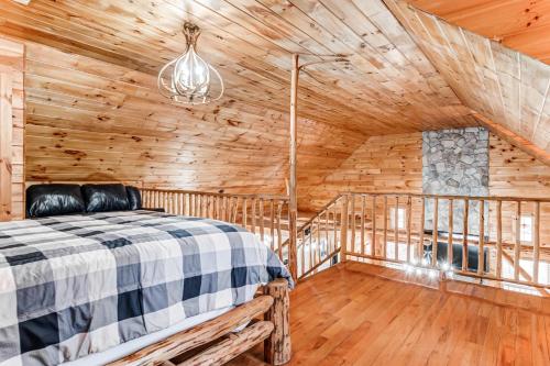 a bedroom with a bed in a wooden cabin at Wooded Wonder in Cleveland