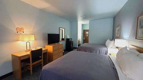 Postel nebo postele na pokoji v ubytování Bay Inn