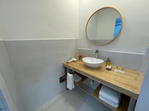 a bathroom with a sink and a mirror at CASA CRISTOBAL Siete Cuartones in Cusco