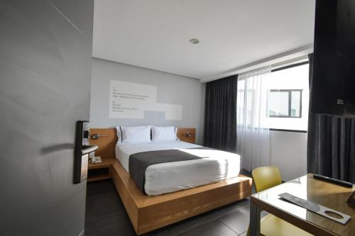 Кровать или кровати в номере Hotel Perla Central