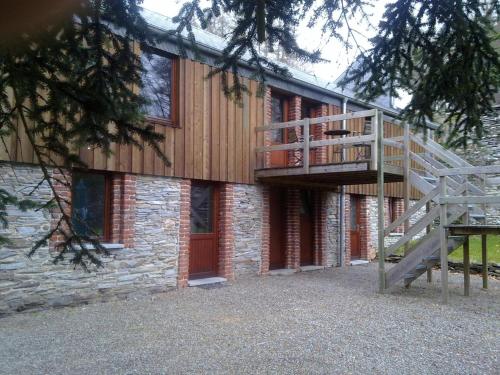 a building with a staircase on the side of it at Parkhotel Villa des Effats Vielsalm in Vielsalm