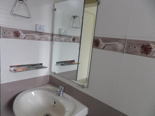 A bathroom at Cosmos Luxury Vimannagar