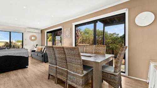 a living room with a table and chairs and a couch at Sunderland Retreat in Sunset Strip