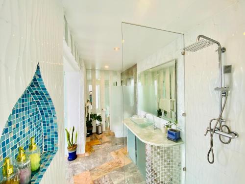 a bathroom with two sinks and a glass shower at Best world vision in Chaweng