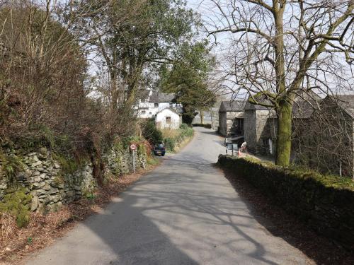 a long road in a village with houses and trees at Ramblers' Rest Lodge in Windermere