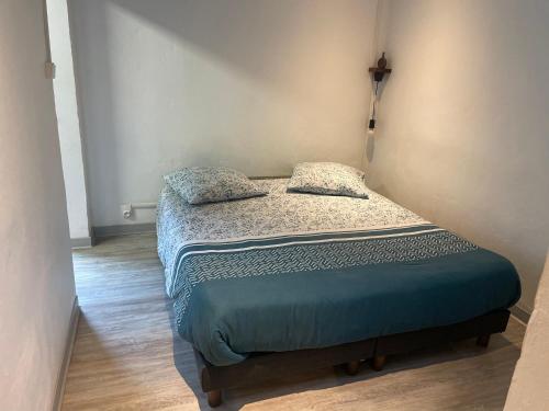 Ένα ή περισσότερα κρεβάτια σε δωμάτιο στο L'améthyste - Bungalow de charme