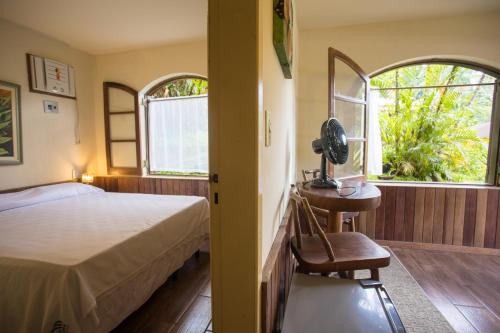 Cama ou camas em um quarto em Hotel da Cachoeira