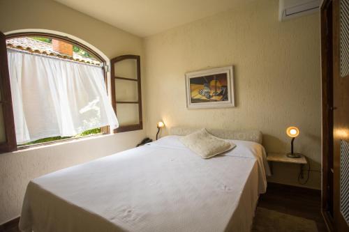 Cama o camas de una habitación en Hotel da Cachoeira