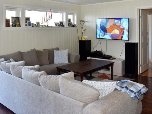 a living room with a couch and a table at 6 person holiday home in SANDANE-By Traum in Sandane