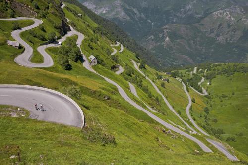 a winding road on the side of a mountain at Au Primerose Hôtel in Argelès-Gazost