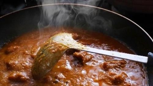 a pot of stew with a spoon in it at Suizenji Comfort Hotel in Kumamoto