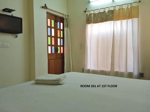 Una cama o camas en una habitación de Rigmor haveli