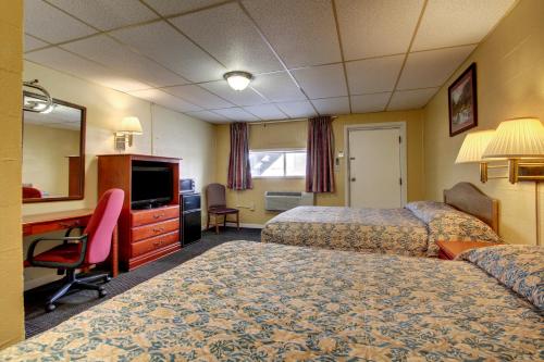 Ένα ή περισσότερα κρεβάτια σε δωμάτιο στο Star Motel
