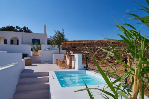 a villa with a swimming pool and stairs at Casa Mardiva Sole in Kampos Paros