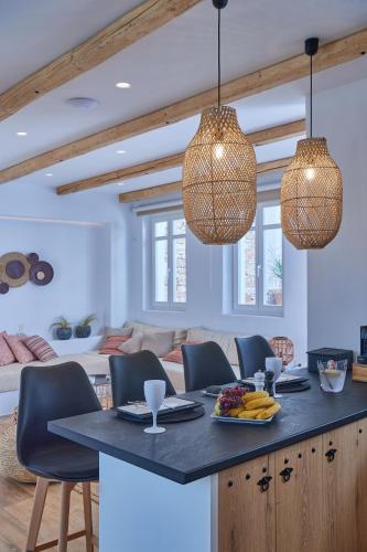 a kitchen with a table with a plate of food at Casa Mardiva Sole in Kampos Paros