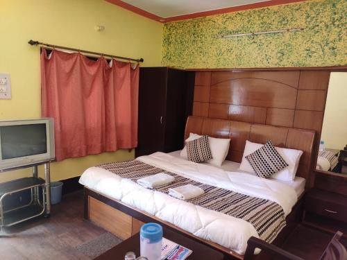 Lova arba lovos apgyvendinimo įstaigoje Hotel Deepraj, Kausani