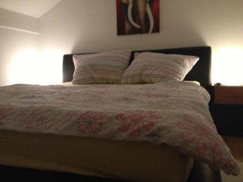 Ein Bett oder Betten in einem Zimmer der Unterkunft Rooms Hiša Divino