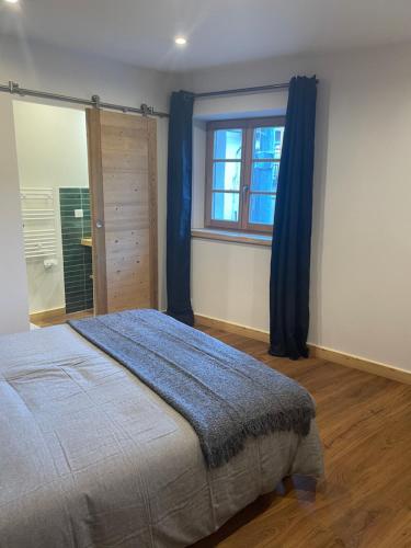 Ένα ή περισσότερα κρεβάτια σε δωμάτιο στο Maison Stabatio Appartement Margot