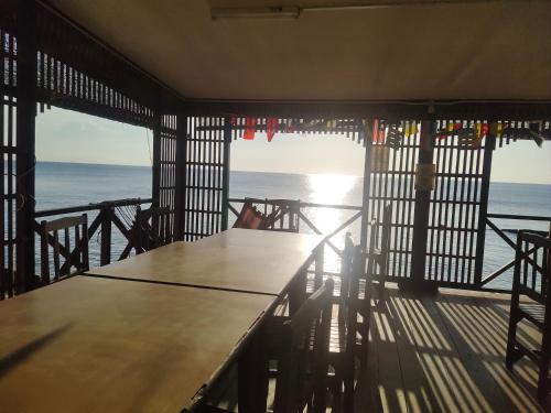a view of the ocean from a room with a table at SPC South Pacific Chalet SP Barakah at ABC Air Batang Village in Tioman Island