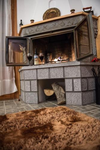 a fireplace in a room with at La Petri Studios with Fireplace & View in Metsovo