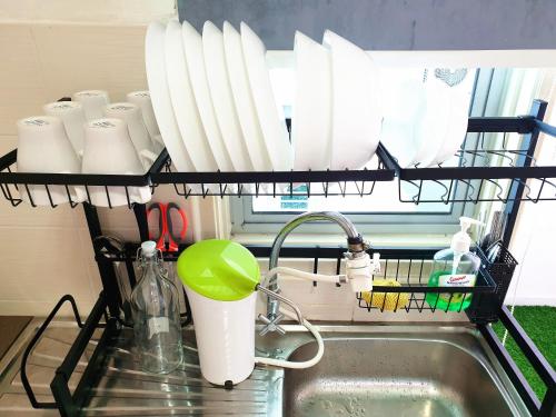 a kitchen sink with a dish drying rack above it at TuR11-Oppesite Pisa Stadium-1min-FoodCourt-MiniMarket in Bayan Lepas