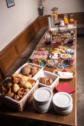 a table with a bunch of different types of food at Gasthaus Schöllmann in Feuchtwangen