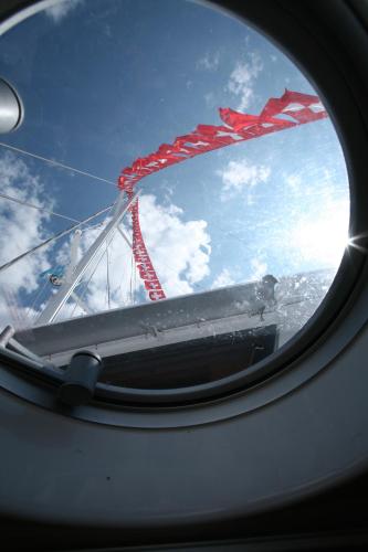 a view of the wing of an airplane window at Floatinn Boat-BnB in Geneva