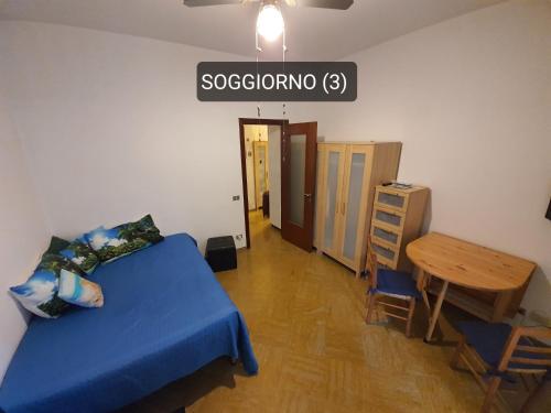 a bedroom with a bed and a table and a street sign at Piccola Oasi Marittima in Lavagna