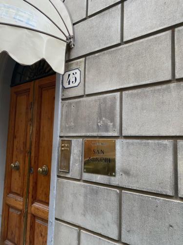 a building with a clock on the side of it at Affittacamere Zanobi 45 in Florence