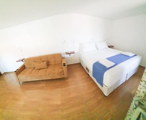 Ένα ή περισσότερα κρεβάτια σε δωμάτιο στο Hotel Chalet Monet - Granja Vianna