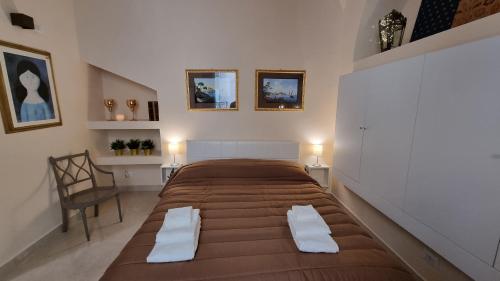 a bedroom with a large bed in a room at FERDINANDO HOME in Caserta