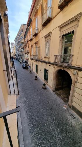an empty street in a city with buildings at FERDINANDO HOME in Caserta