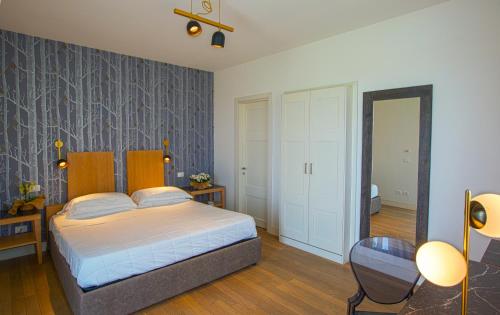 a bedroom with a bed and a table and a chair at Podere del Priorato in Albinia