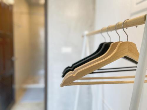 a wooden hanger in front of a door at LeeHo B&B 李何寓所 in Hualien City