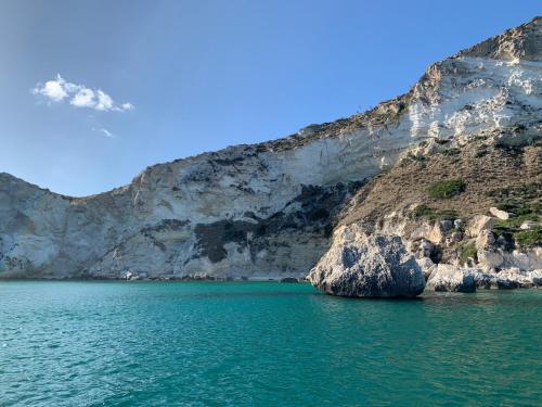a view of the water and a cliff at Hotel Poetto in Cagliari